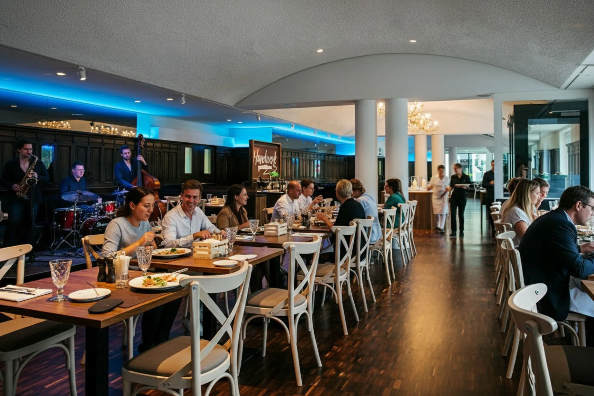 View of a restaurant with guests dining and enjoying live music.