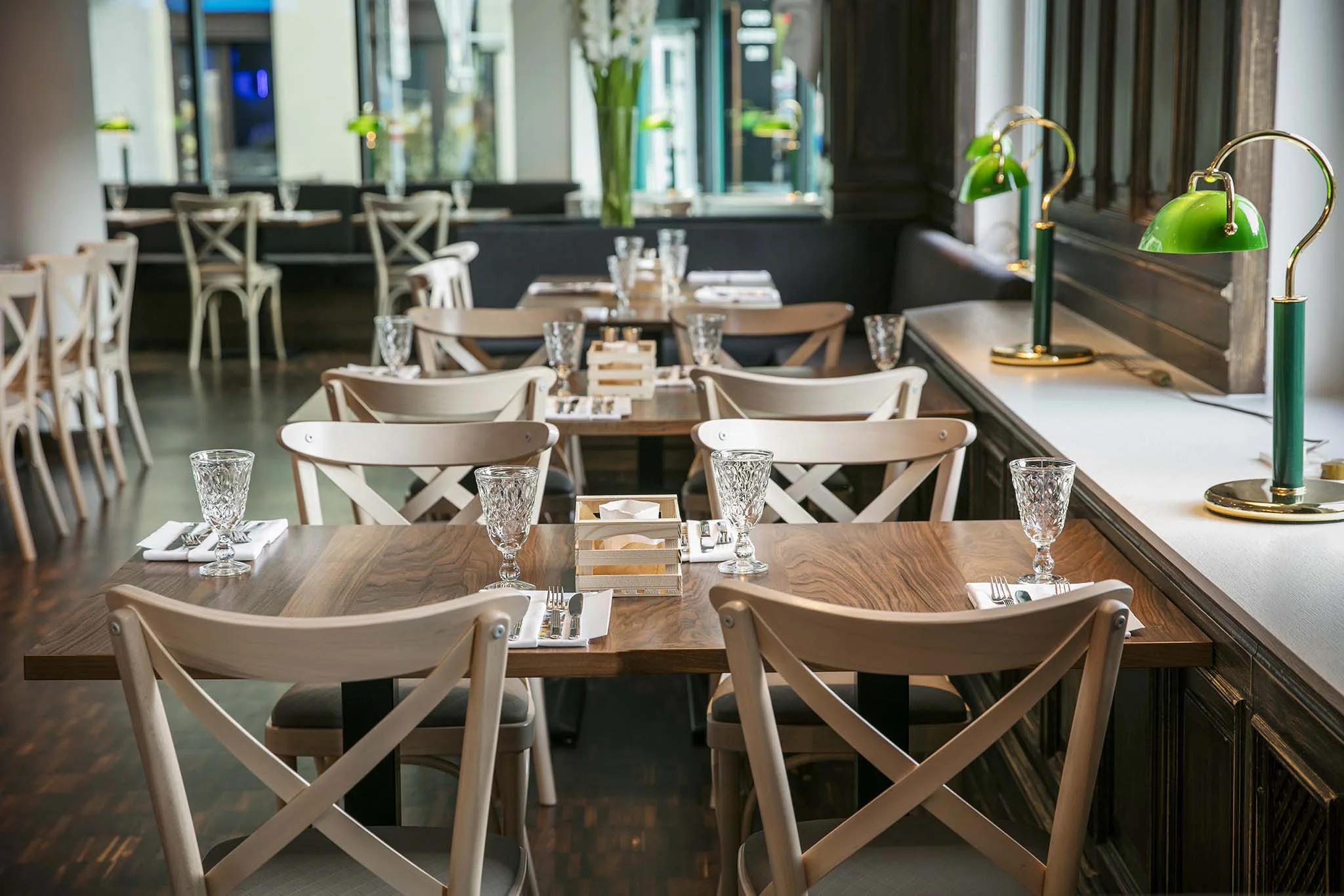 View of a modern restaurant with elegant tables and chairs.